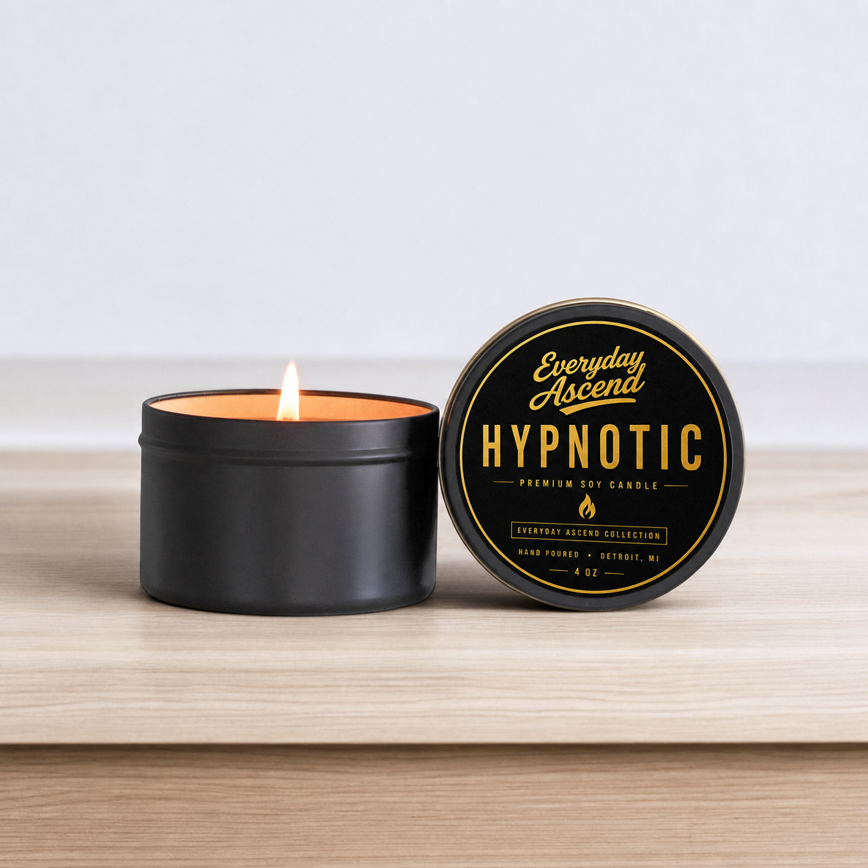 Hypnotic hand-poured tropical soy candle in a matte-black 4 oz tin by Everyday Ascend.