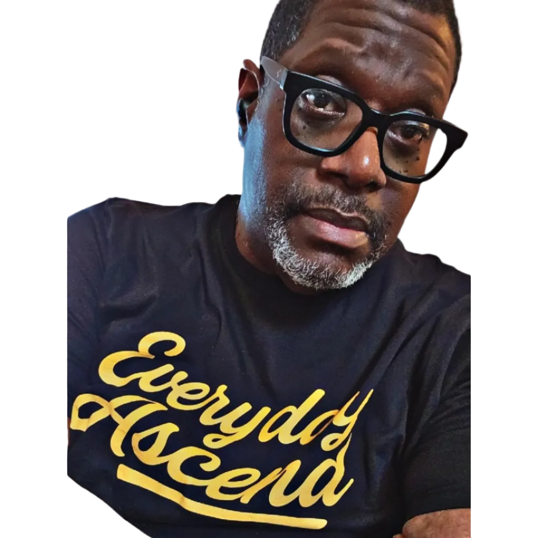Man wearing a black t-shirt with 'Everyday Ascend' in gold text on a white background